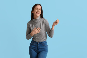 Body positive woman on blue background