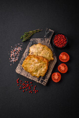 Delicious juicy fried chicken or pork pancakes with salt, spices and herbs