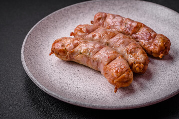 Delicious juicy grilled chicken or pork sausages with salt, spices and herbs