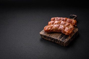 Delicious juicy grilled chicken or pork sausages with salt, spices and herbs