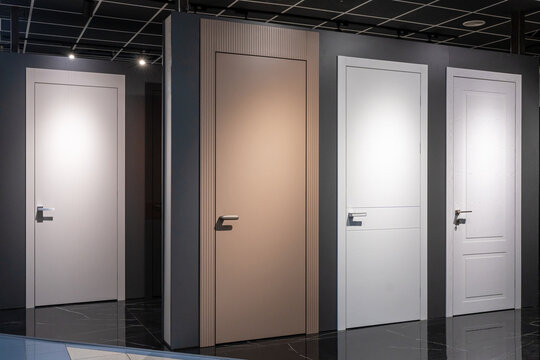 Shop window of doors. A large selection of doors for house. Exhibition sale in the store.