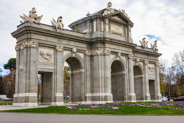 Fototapeta na wymiar Alcala Gate (Puerta de Alcala, 1778) - Neo-classical monument in Independence Square (Plaza de la Independencia) in Madrid, Spain.