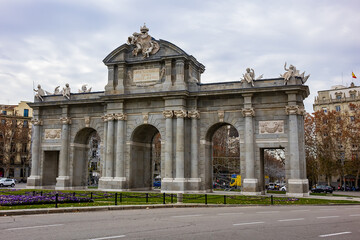 Fototapeta na wymiar Alcala Gate (Puerta de Alcala, 1778) - Neo-classical monument in Independence Square (Plaza de la Independencia) in Madrid, Spain.