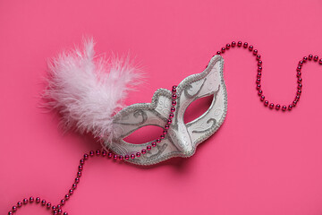 Carnival mask on pink background
