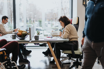 Successful multicultural team working in modern office with happy businesspeople discussing project solutions.