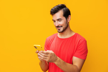 Man studio portrait copy yellow mobile phone technology happy cyberspace smartphone phone communication smiling space