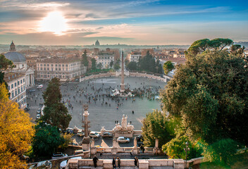 Piazza del Popolo in the evening, seen from Terrazza del Pincio, with the Vatican Dome hardly seen in the background. Scenic sunset in Rome, Italy.