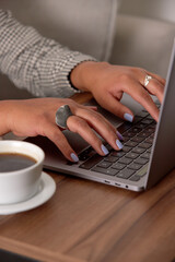 Woman's hands typing