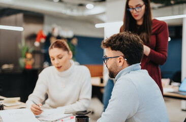 Successful collaboration between creative entrepreneurs in a corporate office.