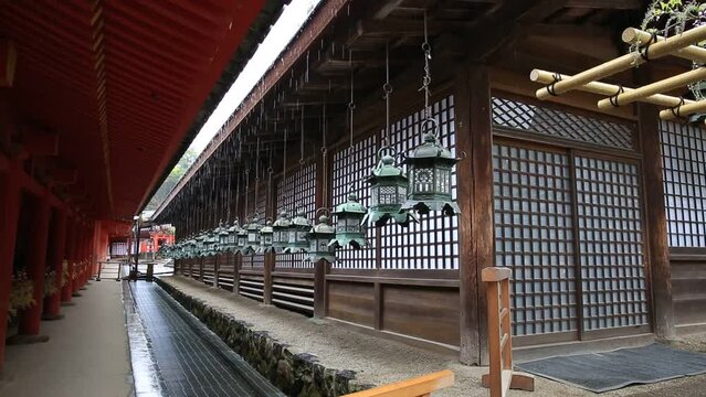 Row of bronze lanterns of Kasuga-Taisha Shrine in Nara, Japan. Kasuga Taisha is Nara's most celebrated shrine. Shinto Temple of Nara with 3000 lanterns.