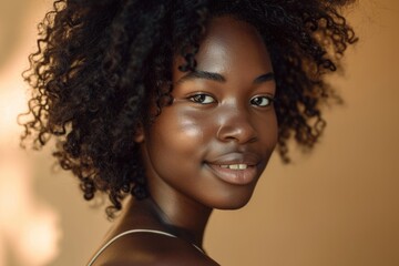 Beautiful portrait of African American woman with healthy skin and curly afro hair.