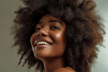 Beautiful woman with afro curly hairstyle in fashion portrait.