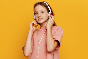 Little girl enjoying the modern technology: Fun-filled moments of music and learning with...