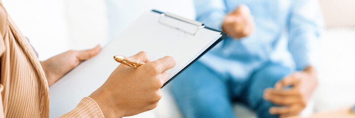 Happy patient and psychologist have mental health conversation in clinic with positive emotion...