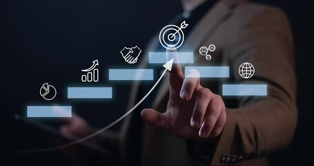 the businessman clicks on a digital hologram with a Target icon .Concept of business strategy and future sustainable business finance action plan.4k video