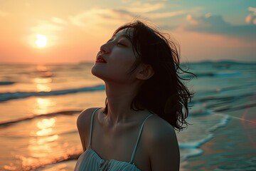 Fototapeta na wymiar Captured in serene solitude, a woman basks in the warm glow of the setting sun on a peaceful beach, her eyes closed in blissful harmony with the water and sky