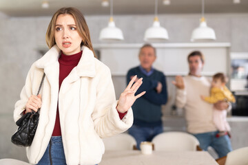 Obraz premium Men quarreling and arguing with girl, annoyed and emotional