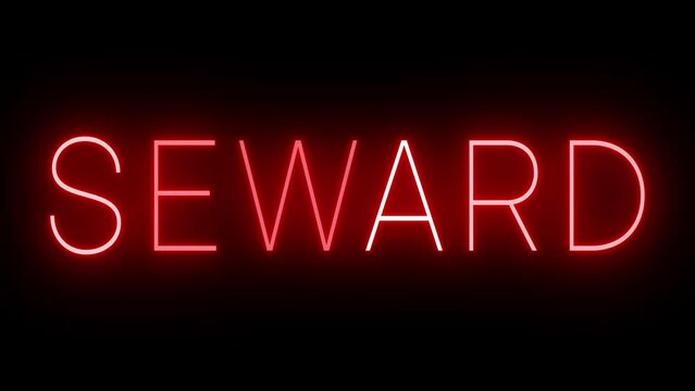 Flickering red retro style neon sign glowing against a black background for SEWARD