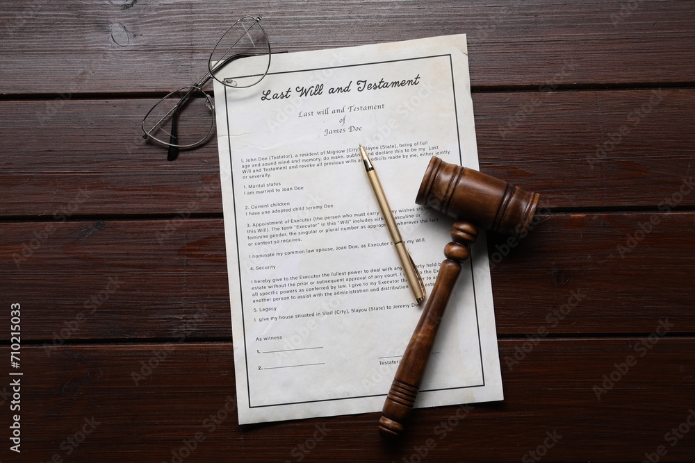 Wall mural Last Will and Testament with glasses, gavel and pen on wooden table, flat lay