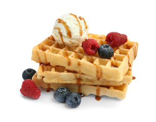 Tasty Belgian waffles with ice cream, berries and caramel syrup on white background