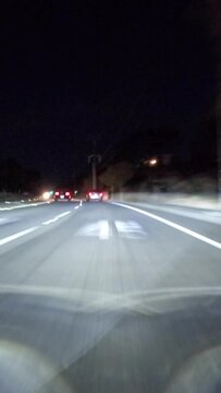 Vertical night driving time lapse view on Erbes Road, Route 23 freeway and Olsen Road in the Thousand Oaks area of Ventura County, California.