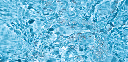 Water surface waving Close-up . Blue Water Flowing