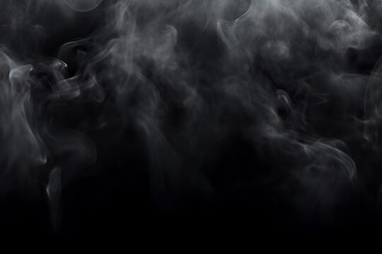 Hypnotic smoke patterns on dark abstract background in enigmatic atmosphere. Sinuous contours of smoke in nuances of shadows and reflections in a deep composition.