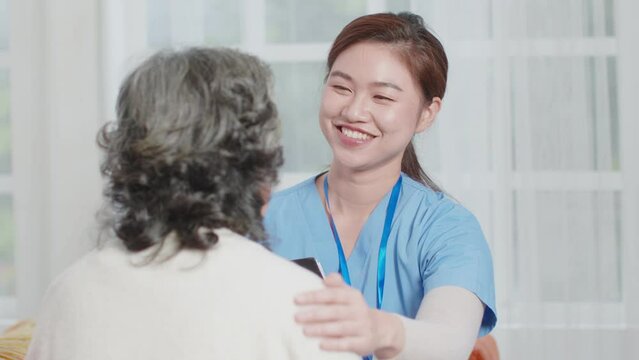 Compassionate Asian doctor exhibits empathy, fostering a comforting and supportive environment for the patient's well-being and care. Elderly Care Concept