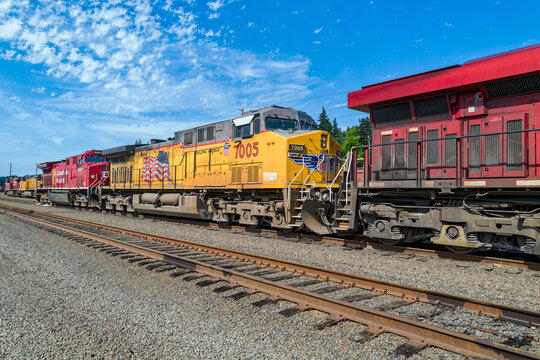 Kalama, Washington, USA - May 20, 2023: Union Pacific 7005 is positioned between 2 Canadian Pacific locomotives at the railyard