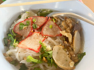 close up view of delicious asian cuisine, red pork noodle