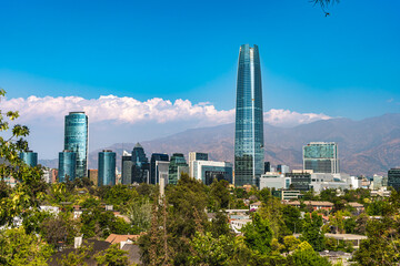 The tallest building in Chile at a sunny day with a park and a river by the side. The financial...