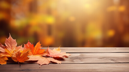 Naklejka na ściany i meble wooden table with orange fall autumn leaves beautiful background design