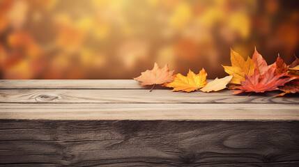 Naklejka na ściany i meble wooden table with orange autumn leaves background