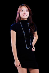 Smiling Asian American Woman Standing In Black Dress