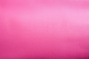 Pink rubber textured yoga mat for sports fitness and gym equipment on a white background - obrazy, fototapety, plakaty