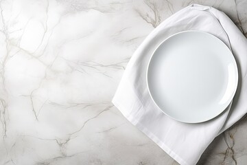 Top down view of white plate utensils and napkin on white stone table Empty space for duplication