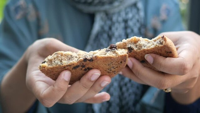  women hand breaking sweet cookies 