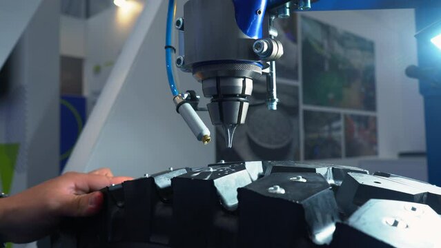 Tire production machine at work, close up. Media. Robotic machine in a tire factory.