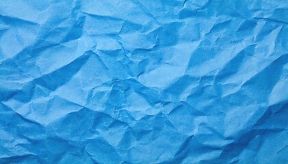 Obraz premium The blue crumpled paper background.