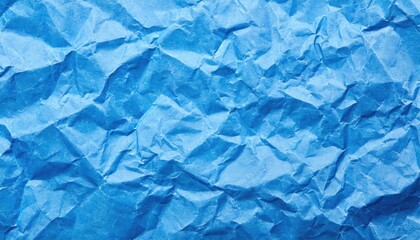 Obraz premium The blue crumpled paper background.