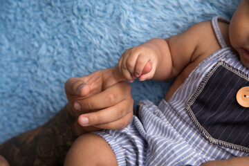 Newborn baby little hands body part affection motherhood - obrazy, fototapety, plakaty
