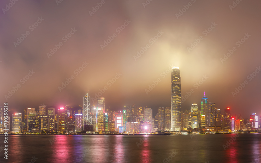 Wall mural foggy night view of victoria harbor in hong kong city