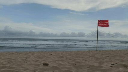 Red flag prohibiting swimming in the sea