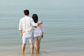 Asian couple on the beach.