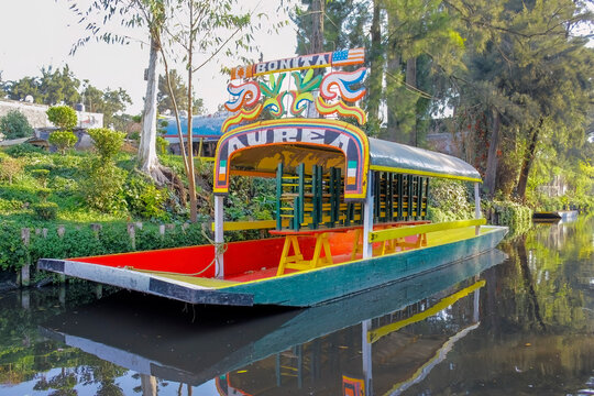 Mexico City, Mexico. Jan 11, 2024. A close up to an empty parked Trajinera a gondola style boat or colourful raft, along the Xochimilco canals.