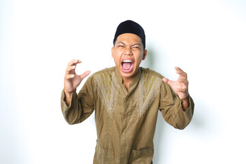 angry asian muslim male screaming with grabbing hand looking at camera isolated on white background