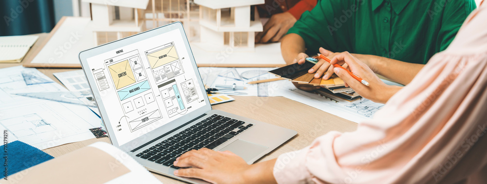 Poster cropped image of interior designer team discuss the material color while laptop displayed website wi