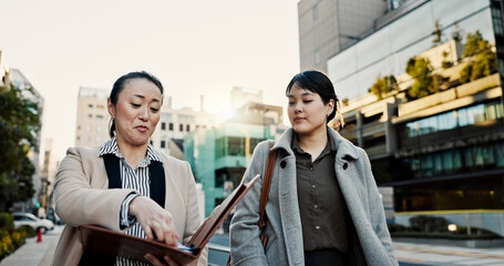Documents, walking and Japanese business people in city for morning commute, travel and discussion....