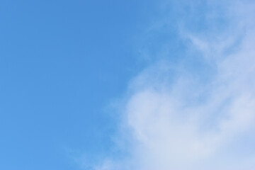 beautiful blue sky and white fluffy group of clouds with sunrise in the morning, natural background