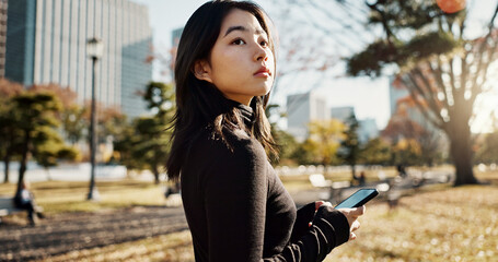 Japanese, woman and smartphone in park, travel and communication with social media and adventure....